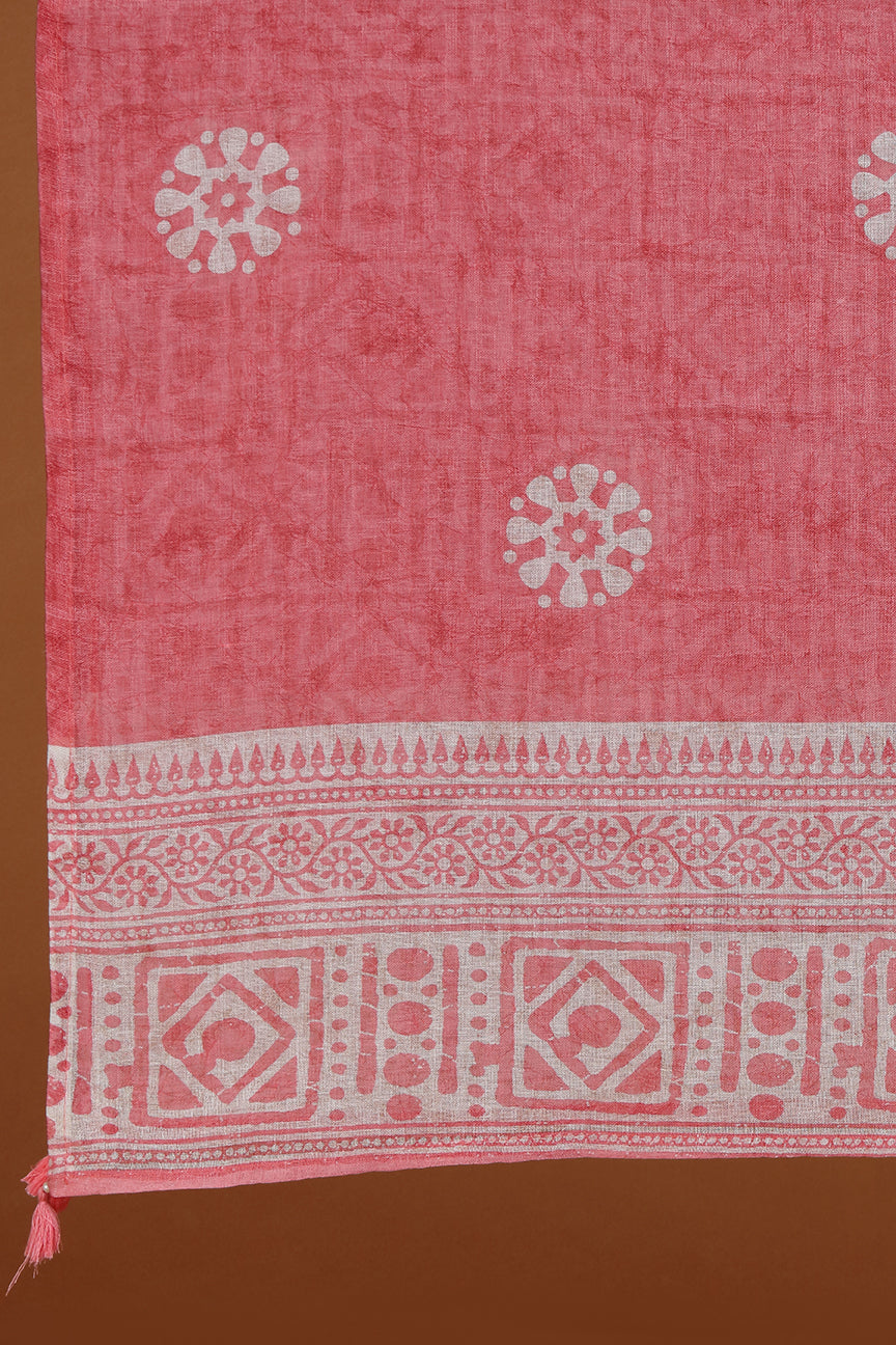 Pink fabric with white patterns on a brown background