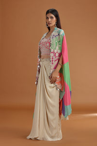 Woman wearing a traditional Pink Crepe Salwar Suit with multi color dupatta