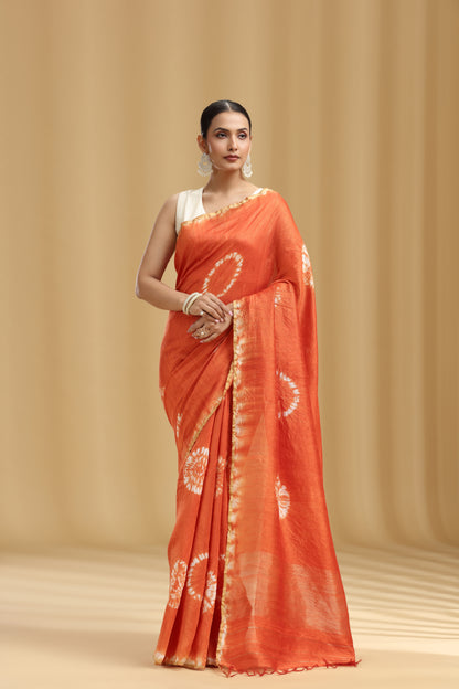 Rust Orange Raw Silk Saree with Batik Print and Unstitched Blouse