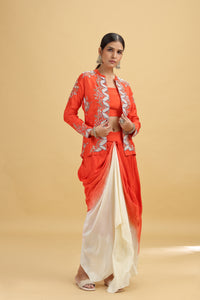 Woman wearing a red and white salwar kameez on a beige background
