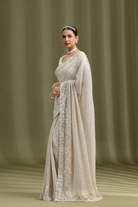 Ivory Net Saree with Sequins, Beads & Cutdana Work (Stitched Blouse)