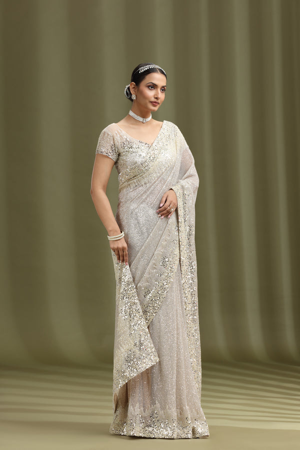 Ivory Net Saree with Sequins, Beads & Cutdana Work (Stitched Blouse)