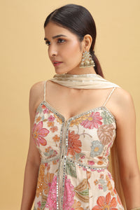 Woman wearing a floral dress with a beige background