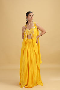 Woman wearing a yellow salwar kameez on a beige background