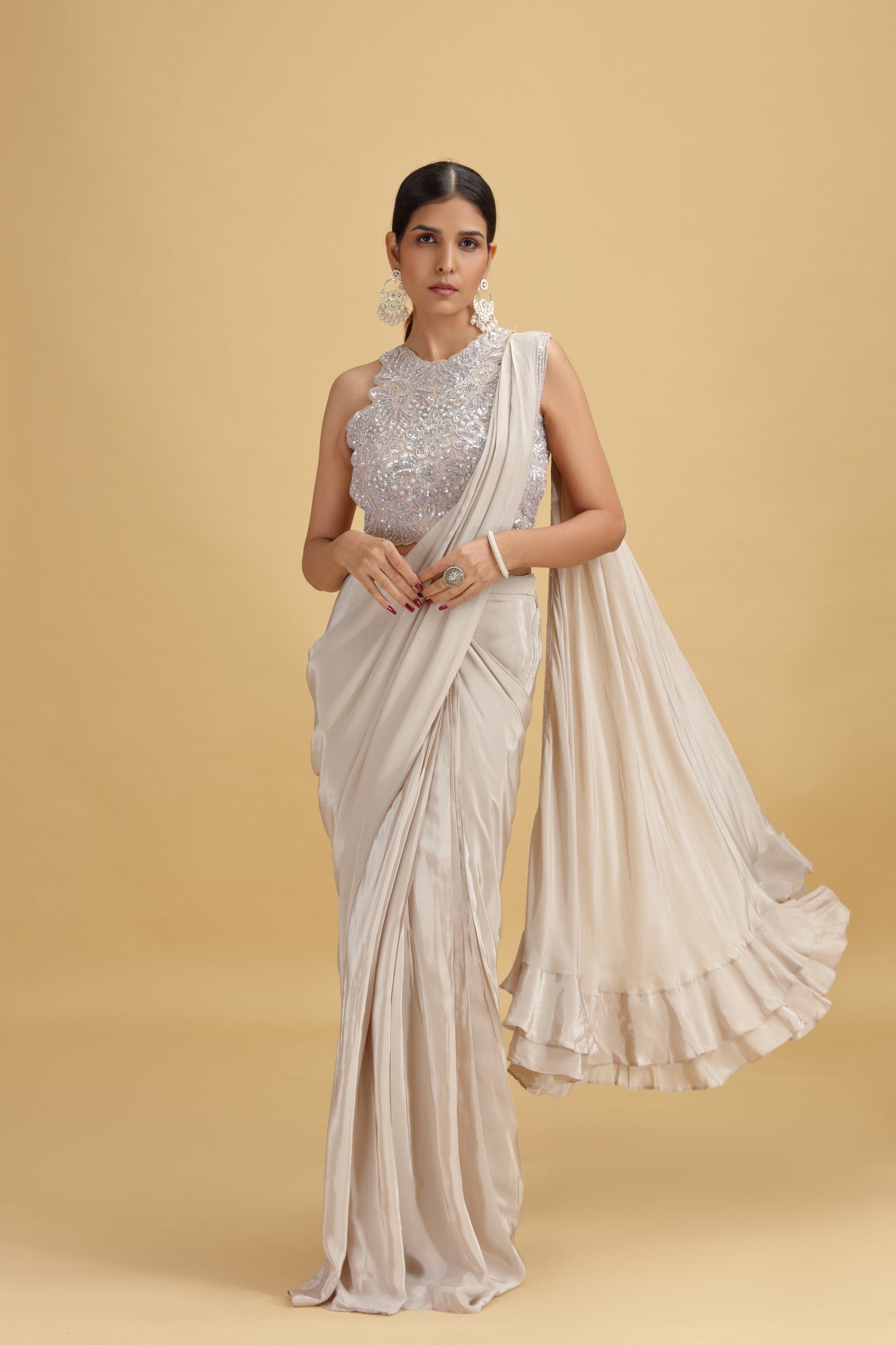 Woman wearing a Beige Crepe Saree 