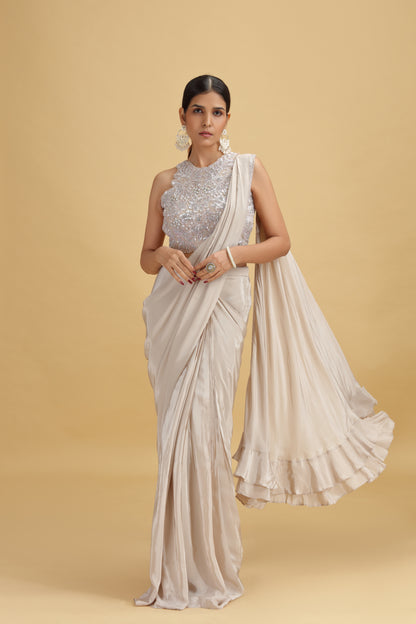 Woman wearing a Beige Crepe Saree 