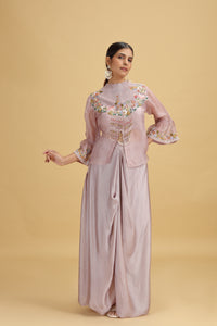 Woman wearing a  Lilac Silk Salwar Kameez embroidered outfit on a beige background