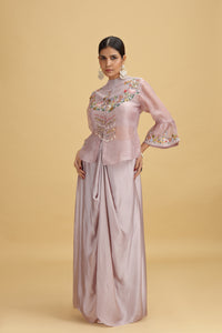 Woman wearing a Lilac Silk Salwar Kameez on a beige background
