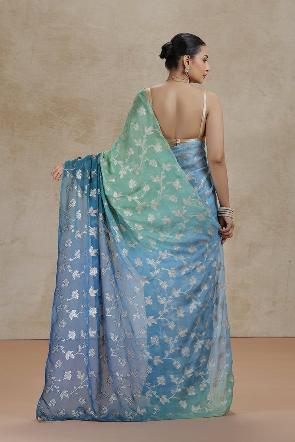 Ambre Organza Saree with Woven Detailing & Teal Blue Dola Silk Blouse