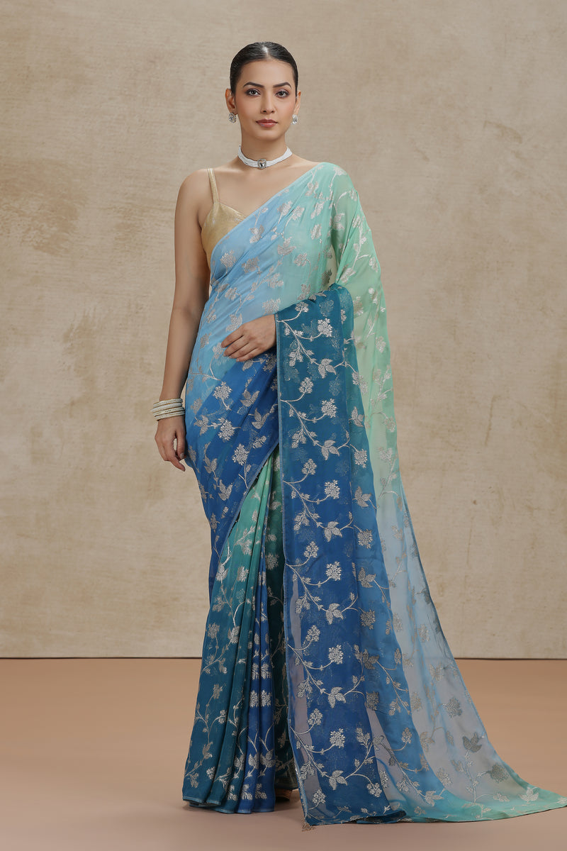 Ambre Organza Saree with Woven Detailing & Teal Blue Dola Silk Blouse