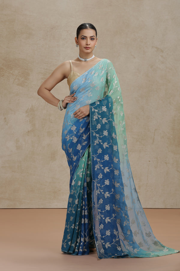 Ambre Organza Saree with Woven Detailing & Teal Blue Dola Silk Blouse