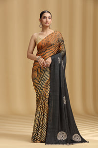 Woman wearing a saree with a zebra pattern on a beige background