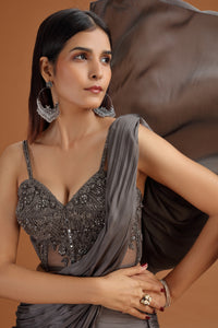 Woman in a Glamorous Dark Grey Net Bridal Lehenga