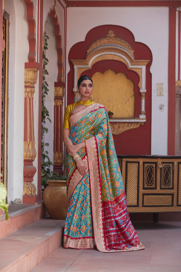 Blue Patola Silk Saree with Gota Patti, Cutdana, and Fresh Knots Embellishment