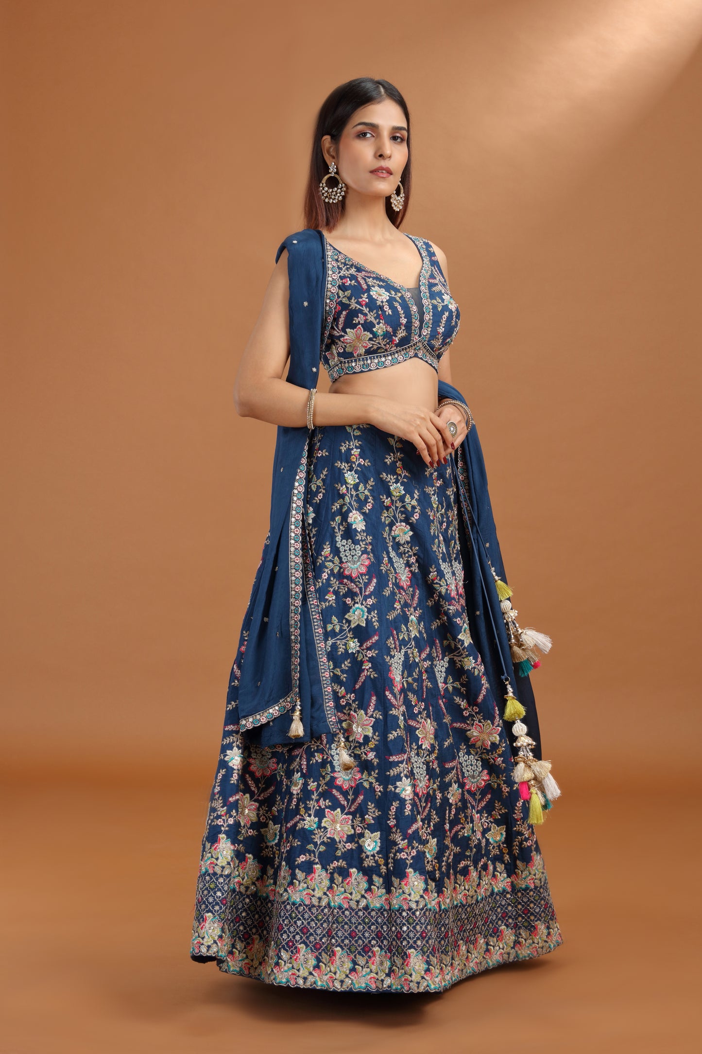 Woman wearing a blue lehenga with crepe dupatta 