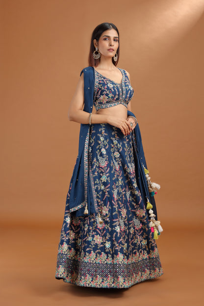 Woman wearing a blue lehenga with crepe dupatta 