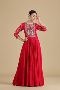 pink kurta set for women with intricate embroidery on a beige background