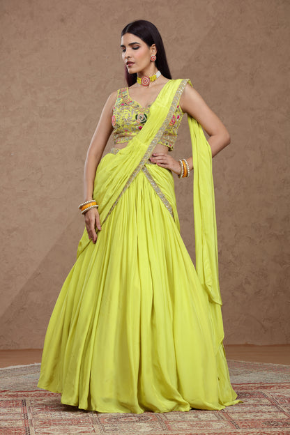 A woman in a vibrant lime green traditional Indian lehenga poses gracefully