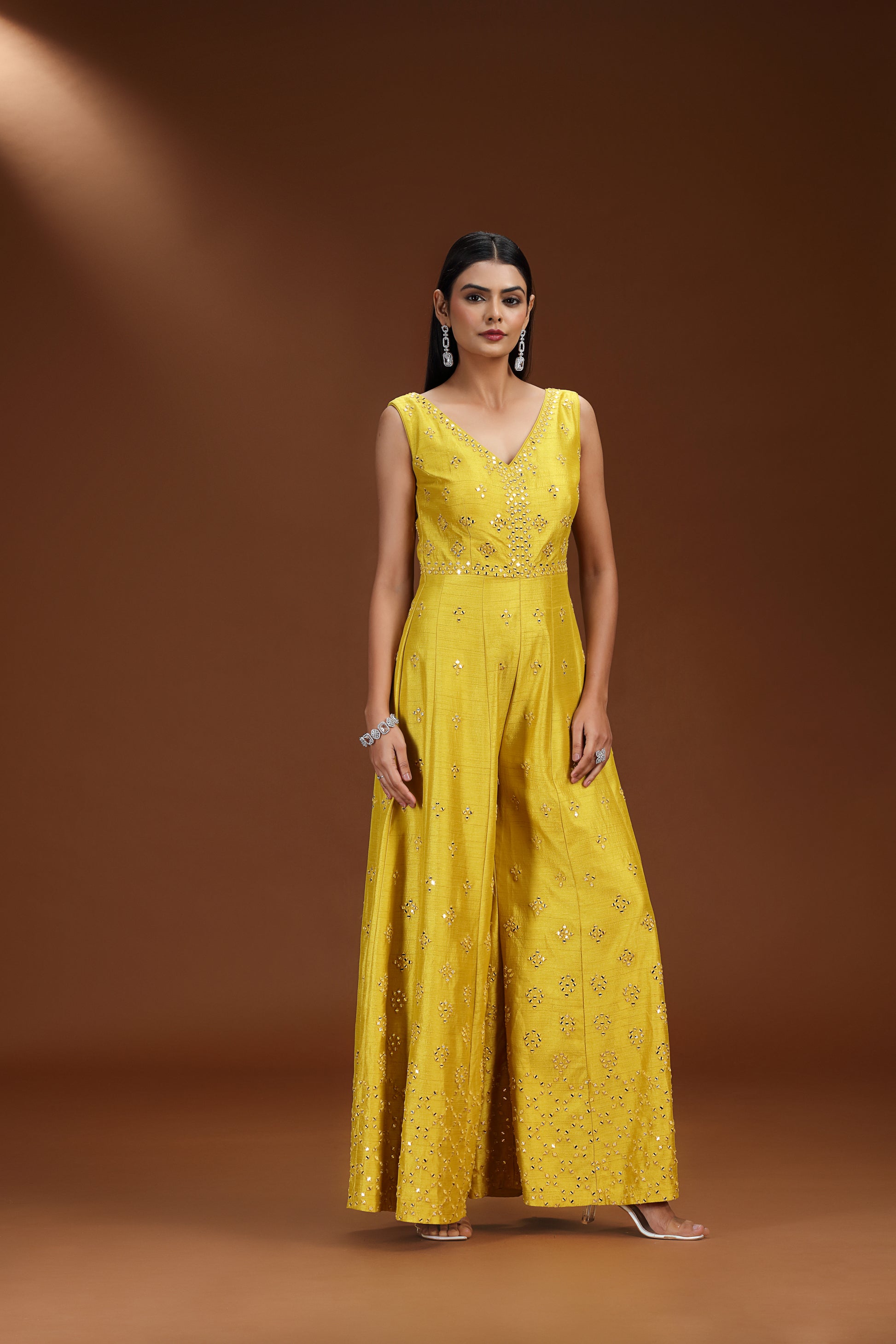 Woman wearing a lime green salwar kameez suit