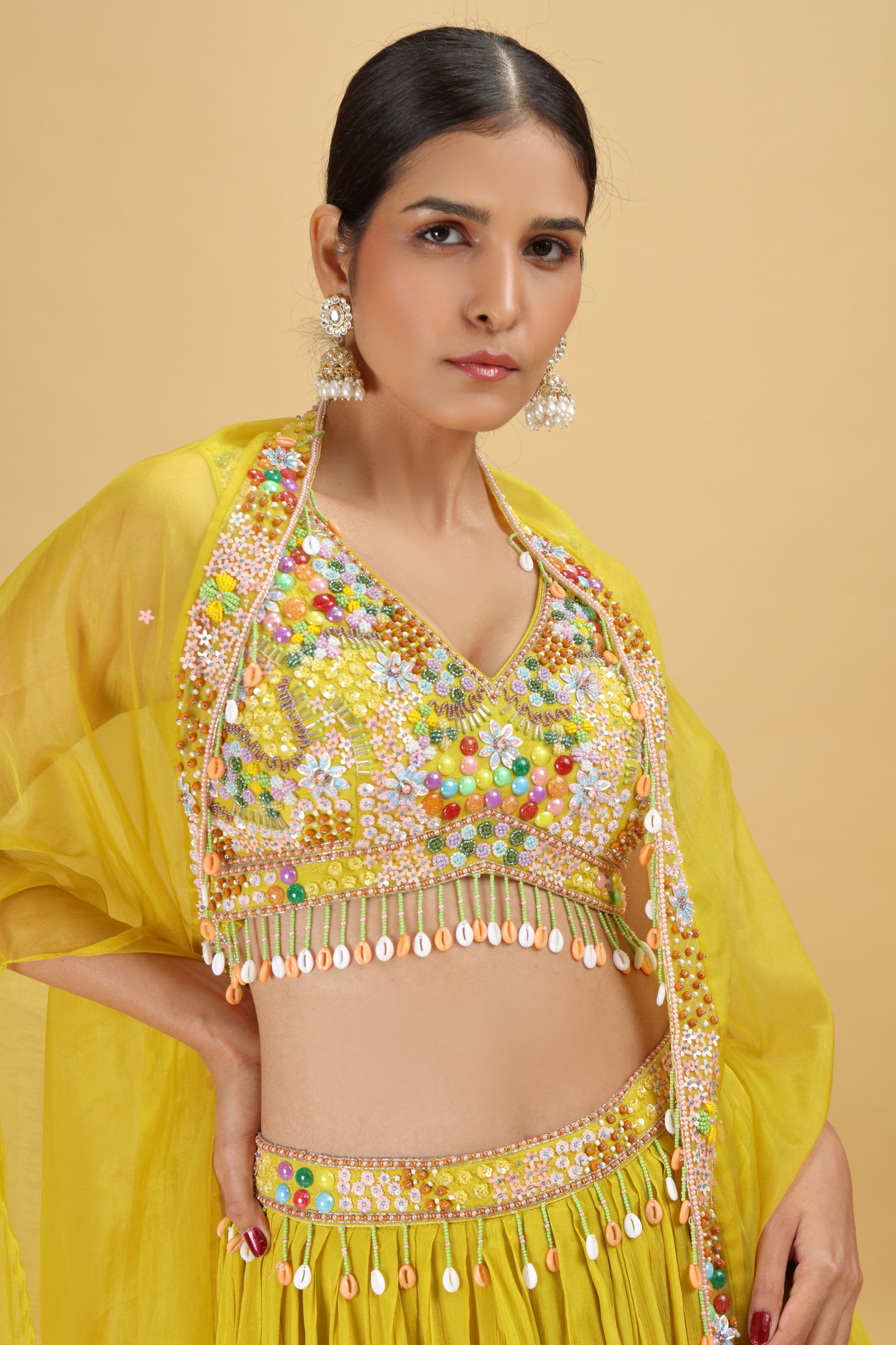 Woman wearing a yellow salwar kameez suit 