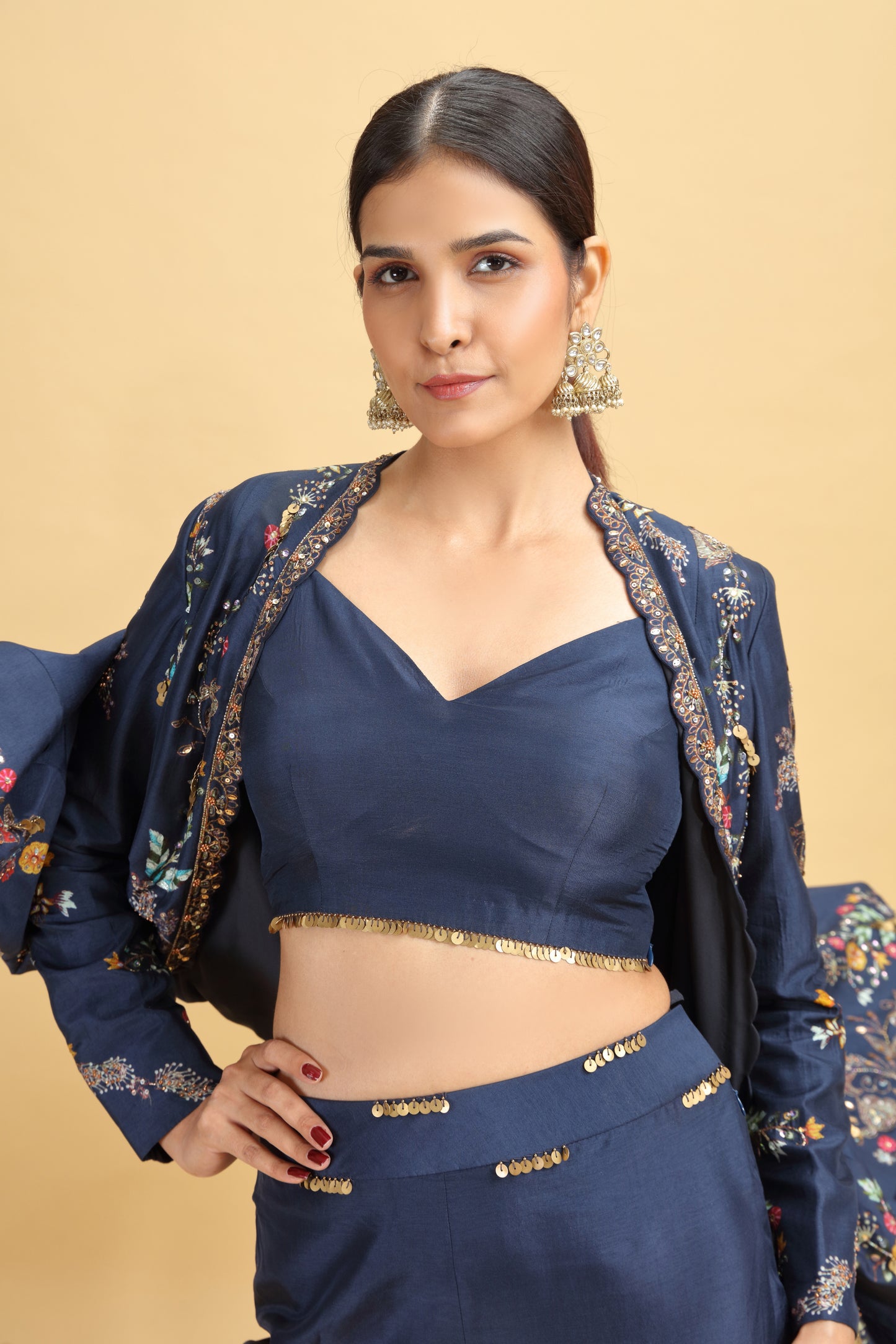 Woman wearing a blue traditional salwar kameez with abla & moti work