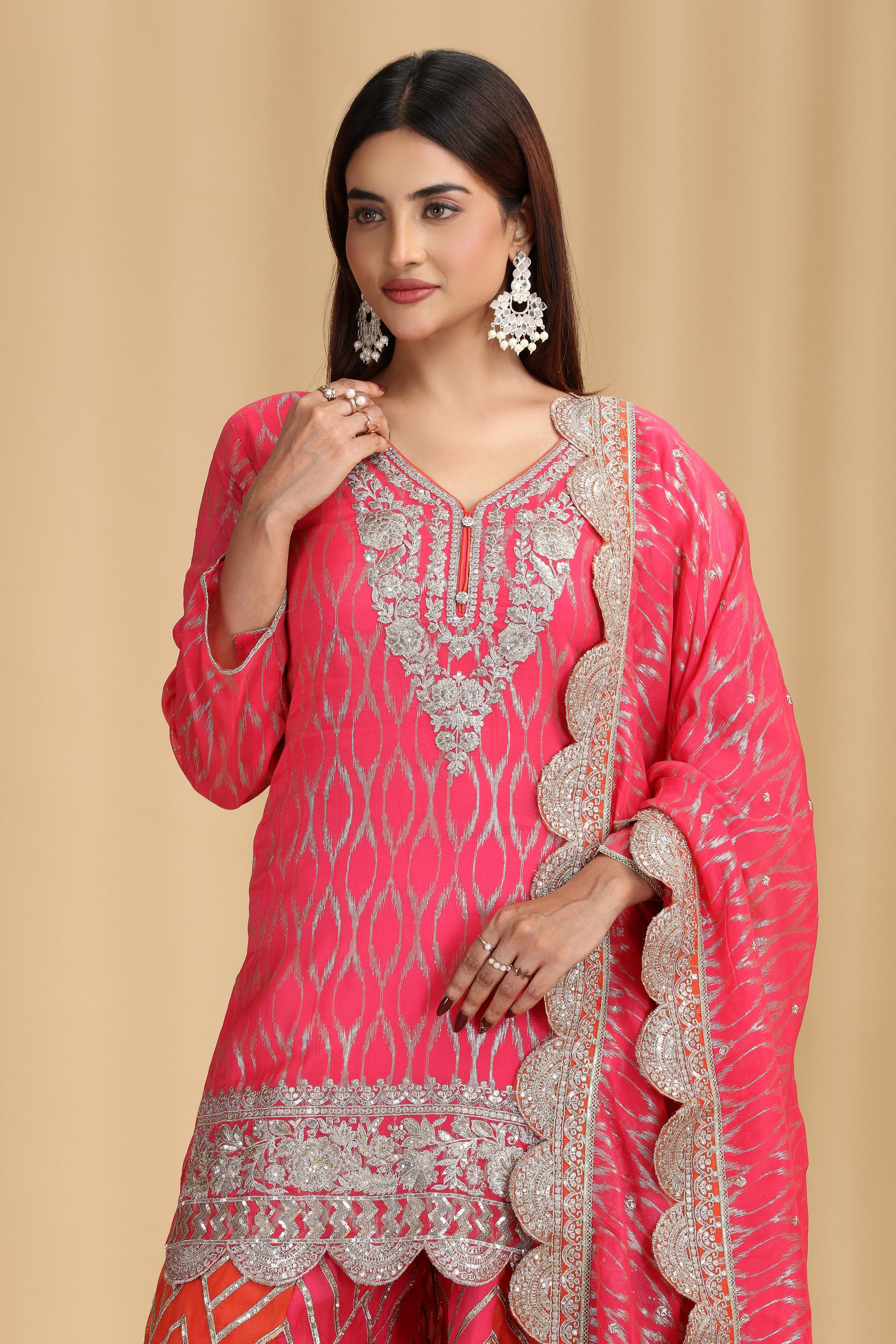 women wearing ready pink georgette salwar suit with zari embroidery