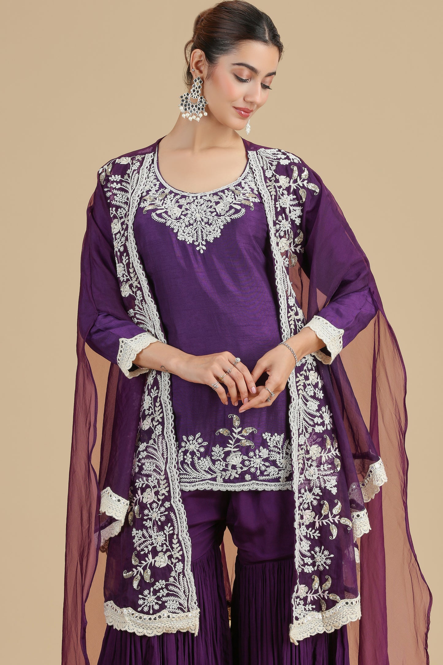 Woman wearing a Abla Work Purple Kurta Set with white embroidery on a beige background
