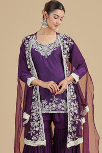 Woman wearing a Abla Work Purple Kurta Set with white embroidery on a beige background