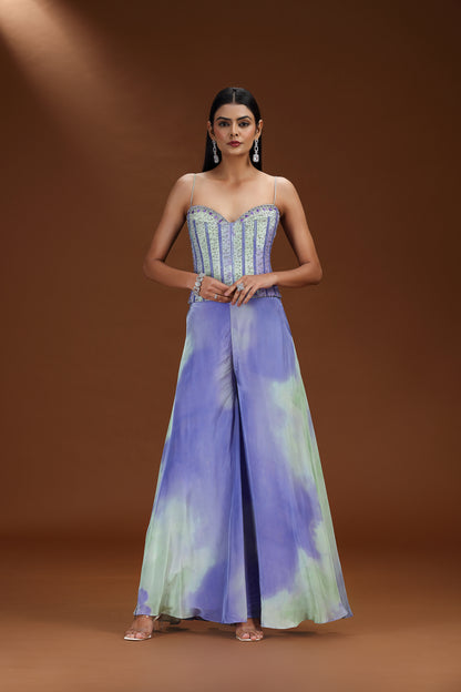 Woman wearing a tie-dye dress with a brown background