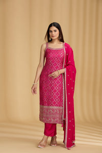 Woman wearing a pink traditional outfit with a beige background