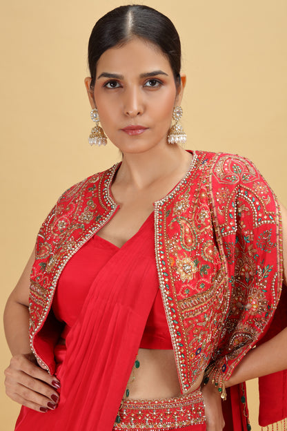 Woman wearing a red saree with dola silk blouse with Moti, Sequins work