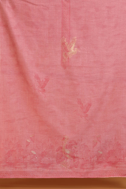 Maroon fabric with embroidered patterns on a wooden surface