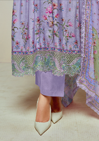 Purple dress with floral embroidery and lace details on a neutral background