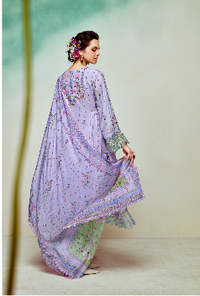 Woman wearing a light purple kurta set with floral patterns on a light background