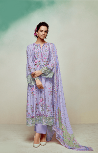 Woman wearing a light purple embroidered kurta with a matching dupatta against a neutral background