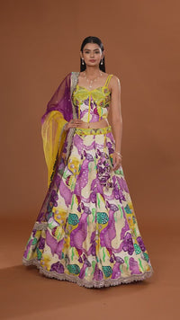 women walking wearing a multicolor art raw silk lehenga