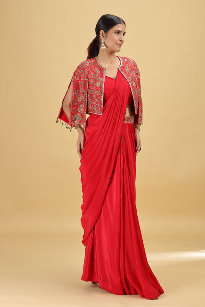 Woman in a red crepe saree with a matching silk blouse